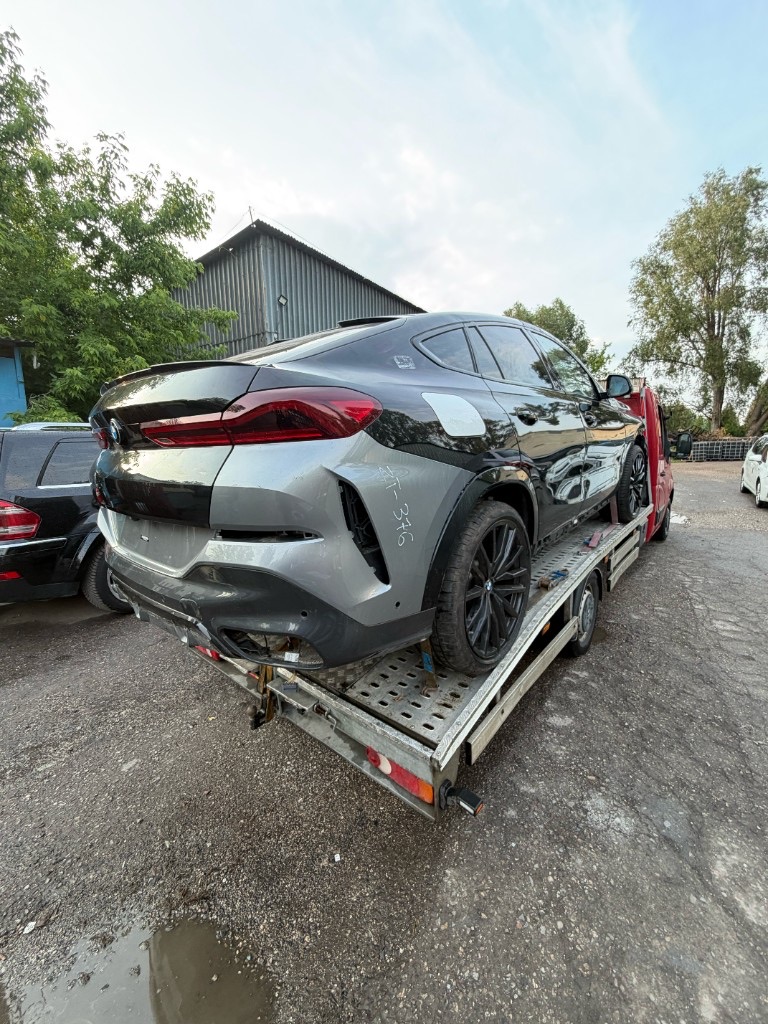 Евакуація BMW X6 евакуатором — допомога на дорозі Варшава INNSER